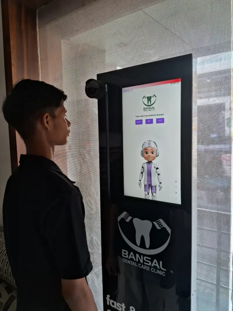 A visitor using Smiley, the free in-clinic AI Smile Scan, at Bansal Dental Care Clinic